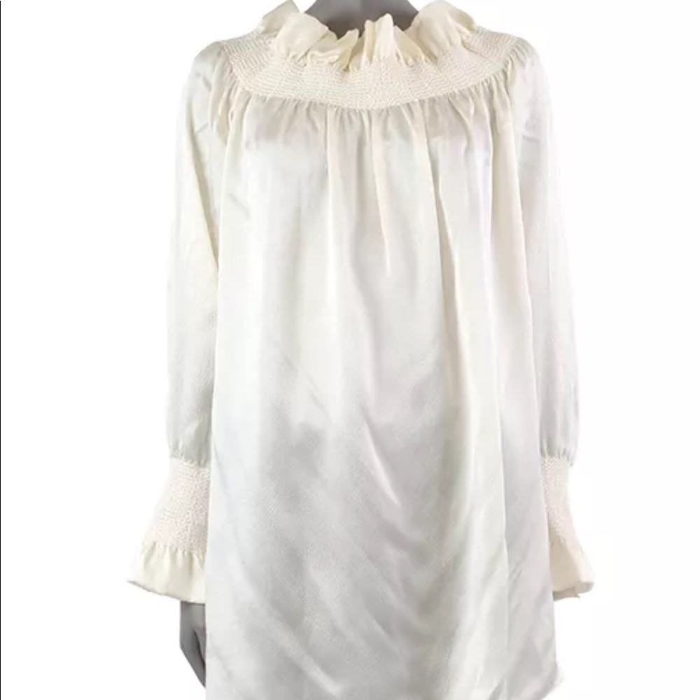 Alexander McQueen 100% silk off-shoulder blouse.